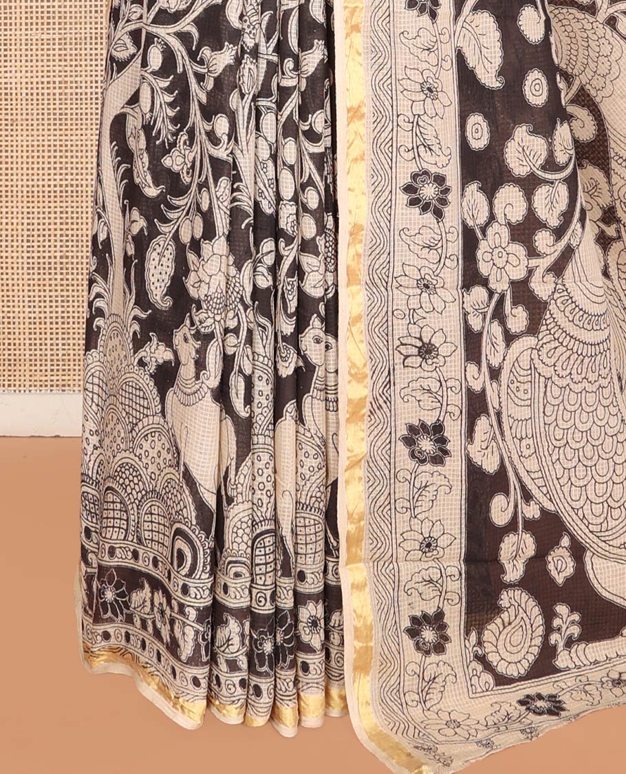 Black Machine-Printed Kalamkari Cotton Saree Features Floral Vine and Pichwai Cow, a Piping Border, Kalamkari Peacock Pallu, and a Matching Blouse