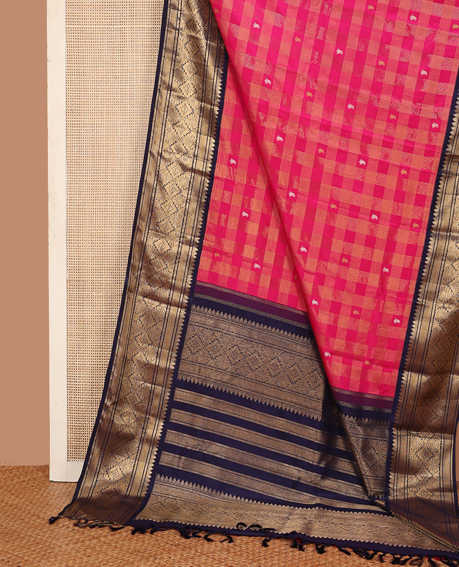 Pink zari buttas and checked Kanchipuram silk saree, contrast border of thazampoo rekku, kathir, mayil kann, and jaal designs