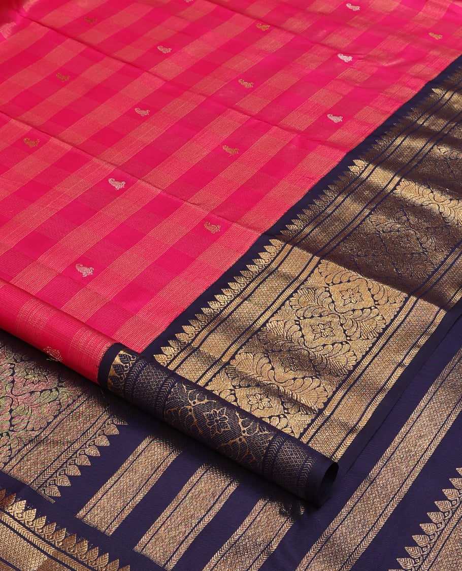 Pink zari buttas and checked Kanchipuram silk saree, contrast border of thazampoo rekku, kathir, mayil kann, and jaal designs