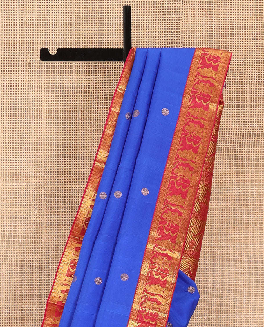 Royal blue chakram buttas Kanchipuram silk saree, contrast border of thilakam mokku,kathir, and Mythological characters, and pallu of Mythological motifs