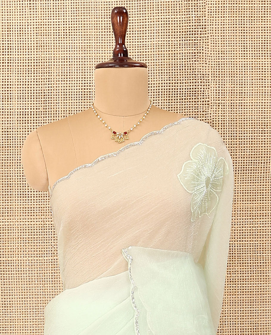 Cream five-petal flowers embroidered saree with scallop stone work border