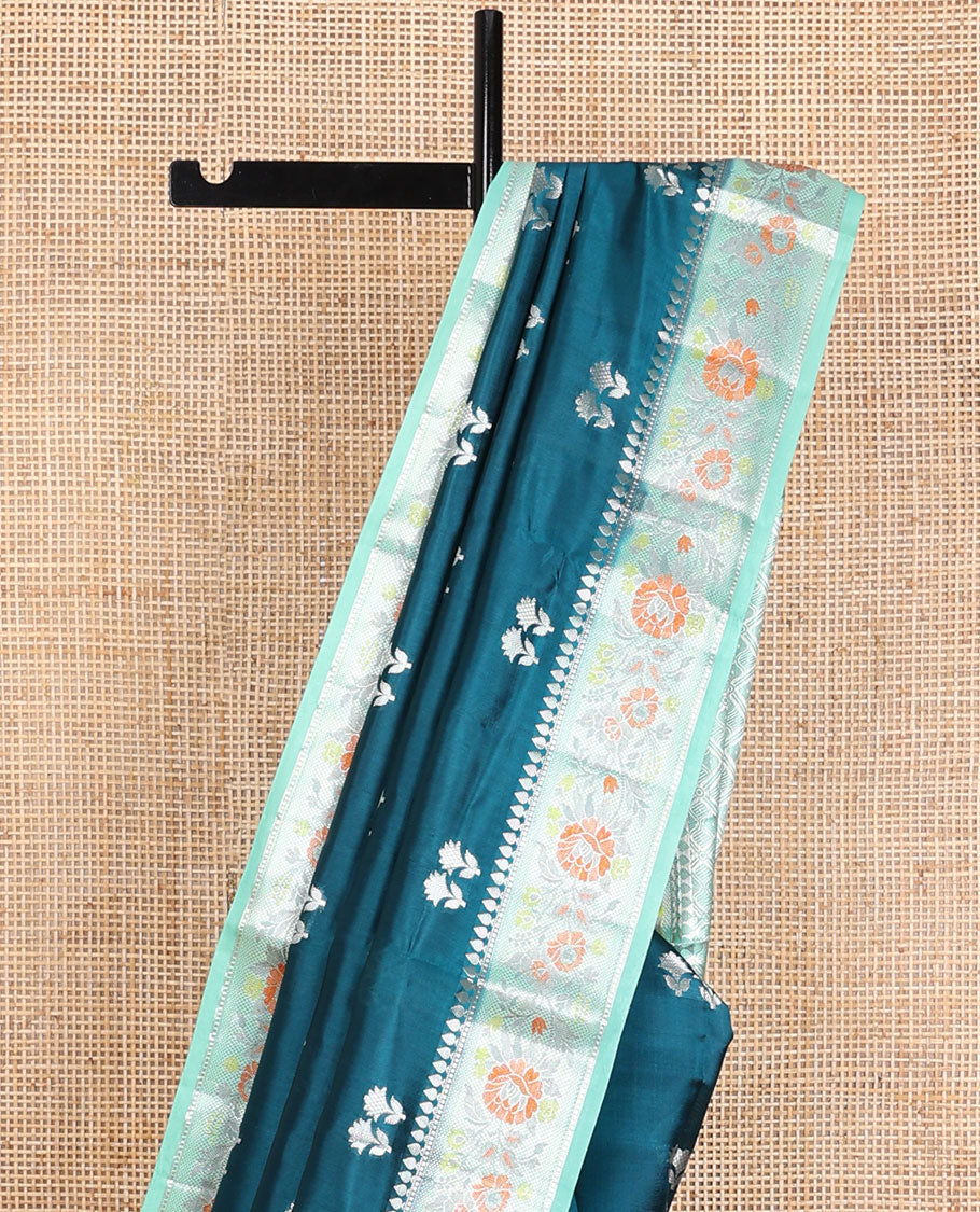Blue raw mango silk saree with floral zari buttas, contrast border of meenakari zari floral designs & jaal pallu
