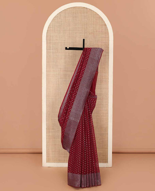 Maroon zari buttas fancy saree, zari floral creeper border, and floral jaal pallu