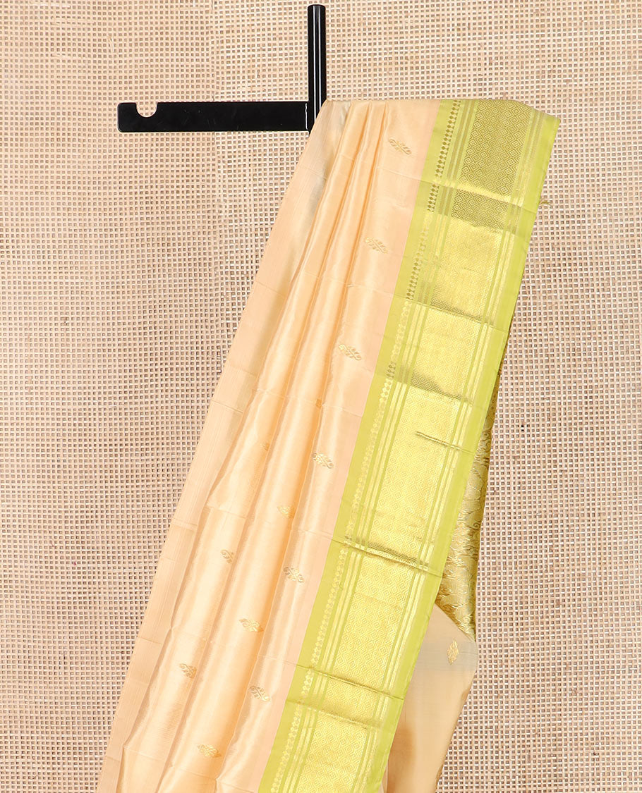 Sandal zari buttas Kanchipuram silk saree, contrast one-sided border of paneer sombu, banaras, and jaal designs, and pallu of floral designs