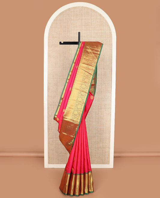 Red zari buttas Kanchipuram silk saree, contrast border of thilakam mokku, muthu, rudraksham, mayil, mayil kann, and kodi visiry designs, and chakram design pallu