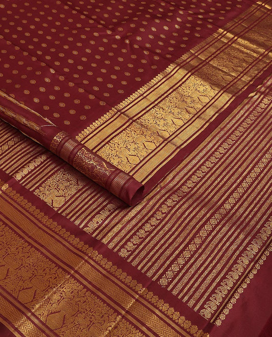 Maroon chakram buttas Kanchipuram silk saree, zari border of banaras,vanki & iru thalai pakshi & pallu of kathir,kamalam,mayil,yaanai,manga & iruthalai pakshi