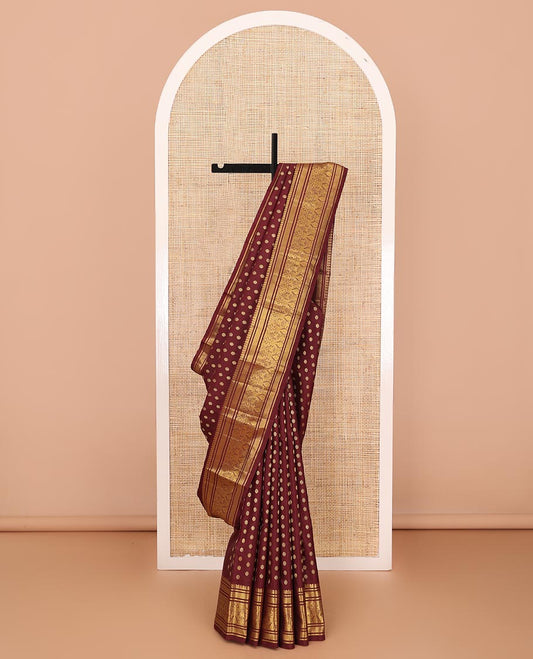 Maroon chakram buttas Kanchipuram silk saree, zari border of banaras,vanki & iru thalai pakshi & pallu of kathir,kamalam,mayil,yaanai,manga & iruthalai pakshi