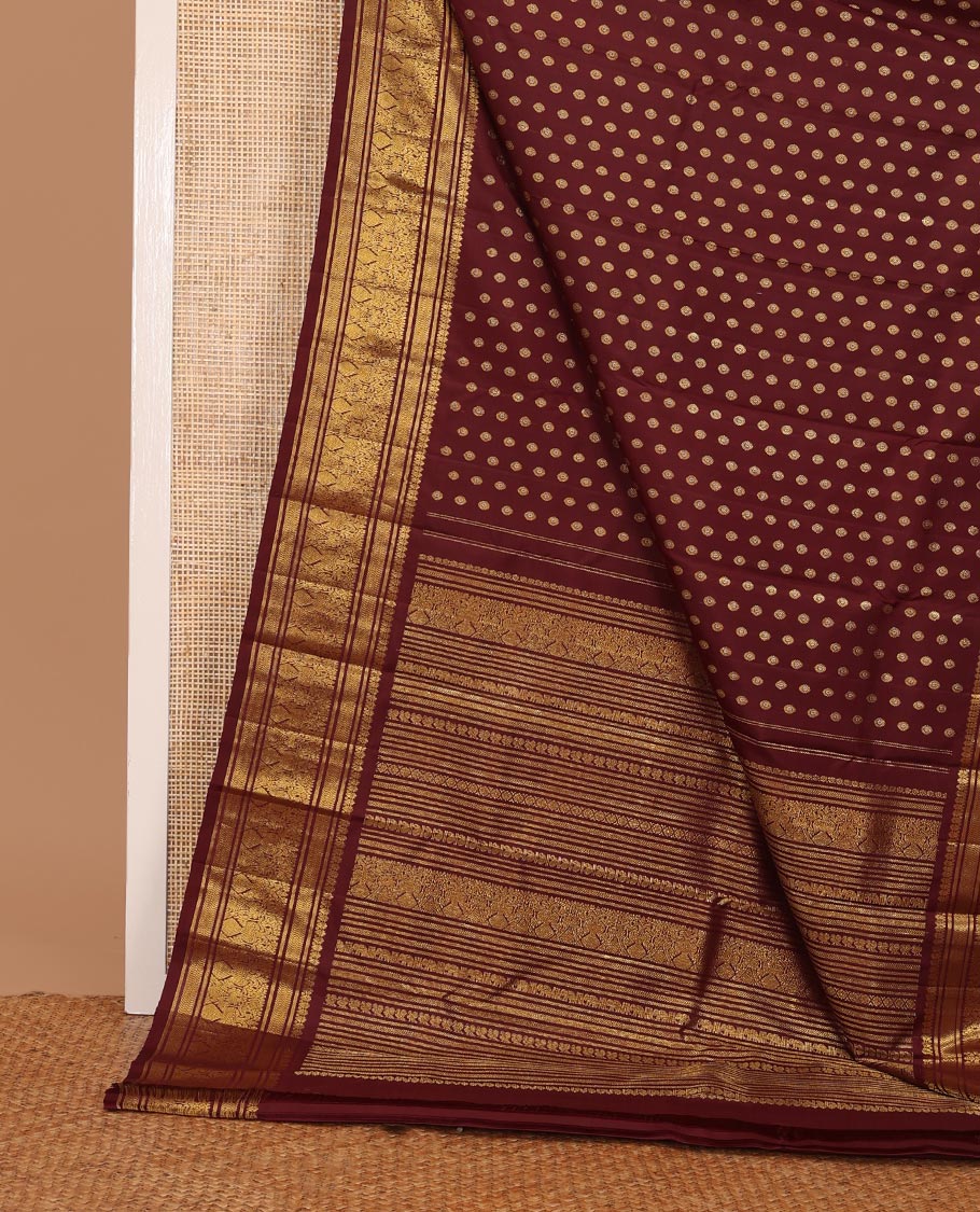 Maroon chakram buttas Kanchipuram silk saree, zari border of banaras,vanki & iru thalai pakshi & pallu of kathir,kamalam,mayil,yaanai,manga & iruthalai pakshi