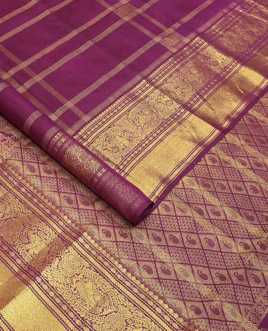 Purple buttas and checked Kanchipuram silksaree,border of thilakam mokku,muthu,rudraksham,kathir,mayil, and paimadi kattam and jaal pallu