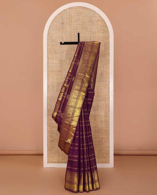 Purple buttas and checked Kanchipuram silksaree,border of thilakam mokku,muthu,rudraksham,kathir,mayil, and paimadi kattam and jaal pallu