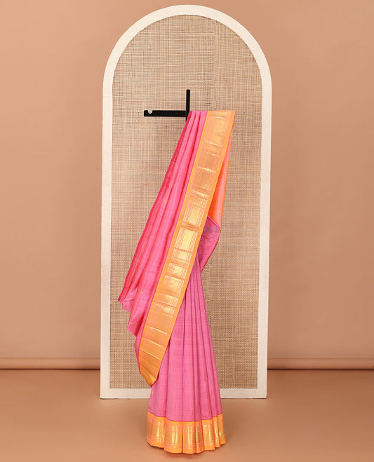 Pink zari buttas Kanchipuram silk saree, contrast one-sided border of panner sombu, banaras, diamond, and paisa designs, and zari design pallu