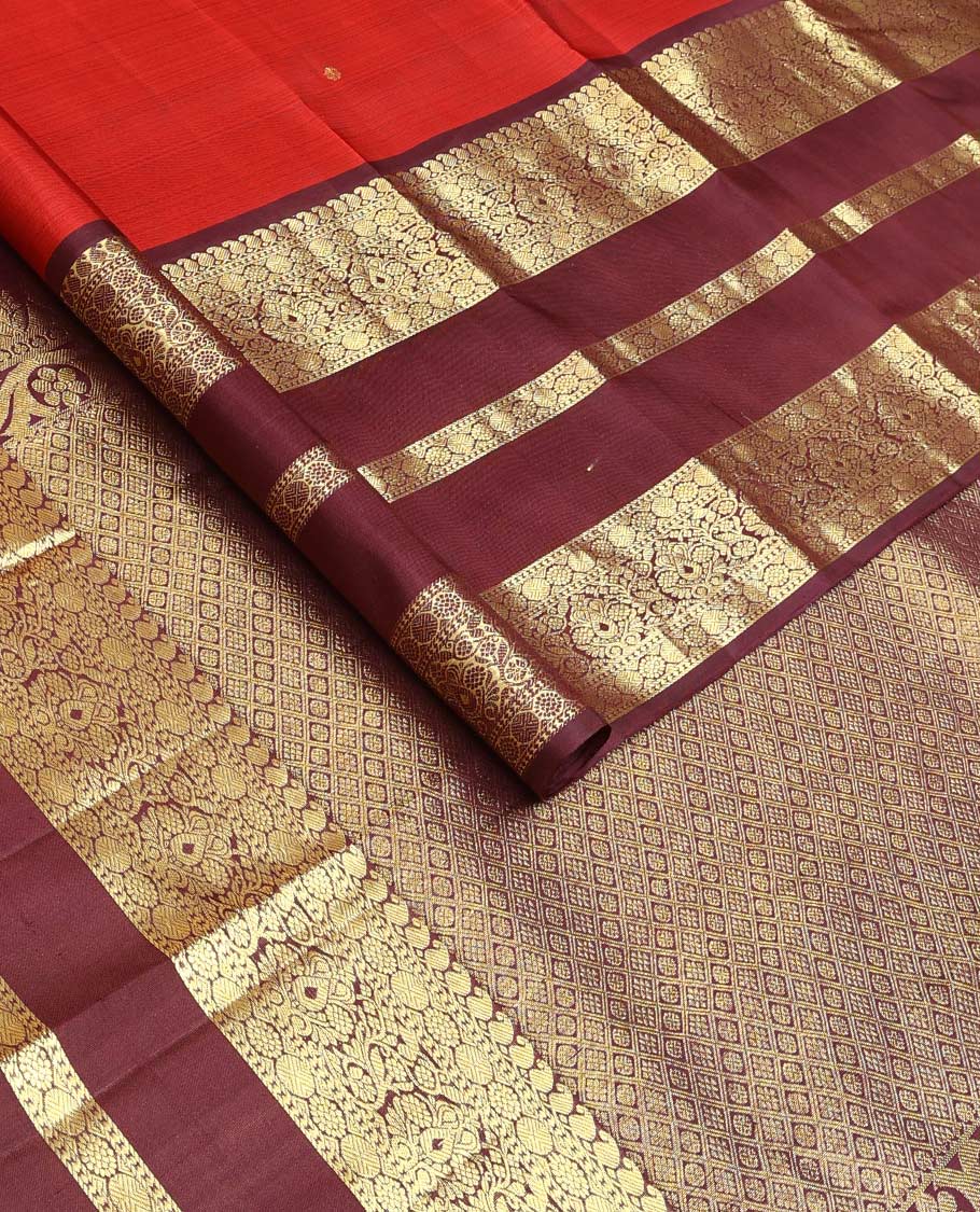 Red zari buttas Kanchipuram silk saree, contrast border of manga mokku, poun, laddu kamalam, and zari designs, and jaal pallu