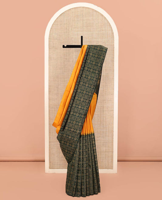 Orange and Green Half-And-Half-Style Kanchipuram Designer Silk Saree, Adorned with Zari Designs All Over Its Body and Border, Pallu Mirrors the Same Intricate Design Weave, and Is Paired with a Contrast Blouse