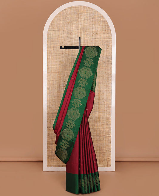 Maroon Mayuri Soft Silk Saree Beautified with Leaf Buttas All Over the Body, Complemented by a Contrast Border of Chakram and Floral Designs, Grandly Decked Up Pallu of Jaal Design, and Paired with a Contrast Blouse