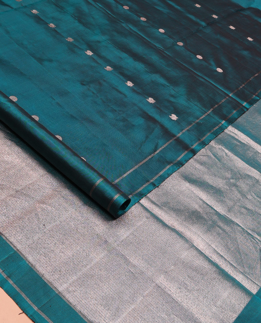 Peacock blue annam chakram buttas soft silk saree, zari piping border, and zari striped pallu