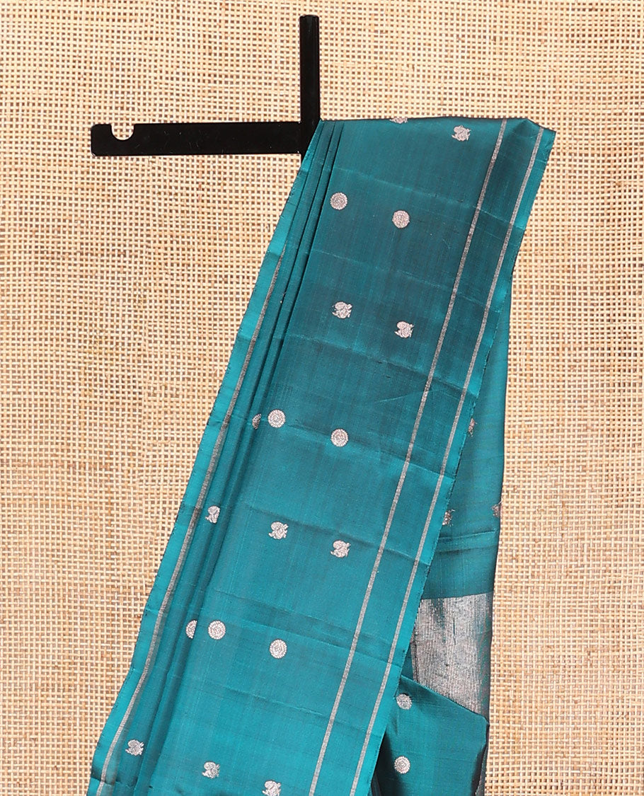 Peacock blue annam chakram buttas soft silk saree, zari piping border, and zari striped pallu