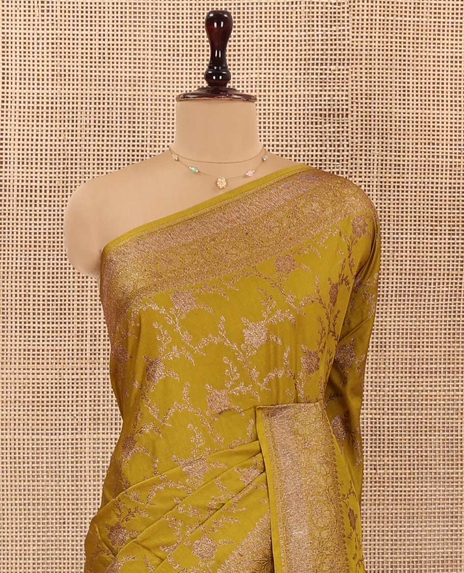 Green Mushru Silk Saree, Elegantly Woven with Floral Jaal Jacquard on Its Body, Sparsely Sparkled Zari Border, Mughal-Style Woven Pallu of Floral Bouquets, and Paired with a Matching Blouse
