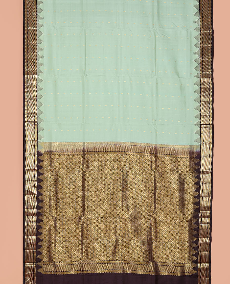 Green nine-yard silksaree with zari buttas,contrast thazampoo reku border of ara bogudi, muthu & ara maadam & jaal pallu