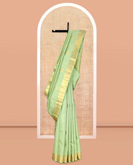 Green Embossed Parambara Silk Saree, Adorned with Zari Border of Rekku, Muthu, Kathir, Kuyil Kann, and Kodi Visiry Designs, Pallu of Mayil Kann, and Matching Blouse