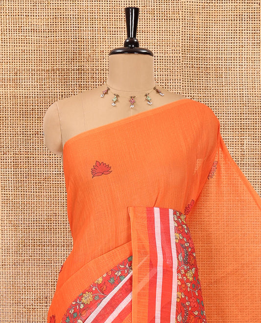 Orange floral motifs printed linen cotton saree with contrast kalamkari floral vine printed border, floral vine printed pallu, and a plain blouse