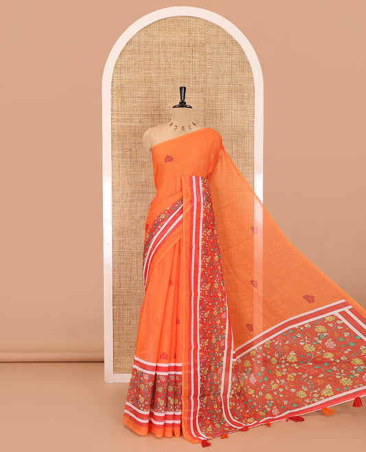 Orange floral motifs printed linen cotton saree with contrast kalamkari floral vine printed border, floral vine printed pallu, and a plain blouse