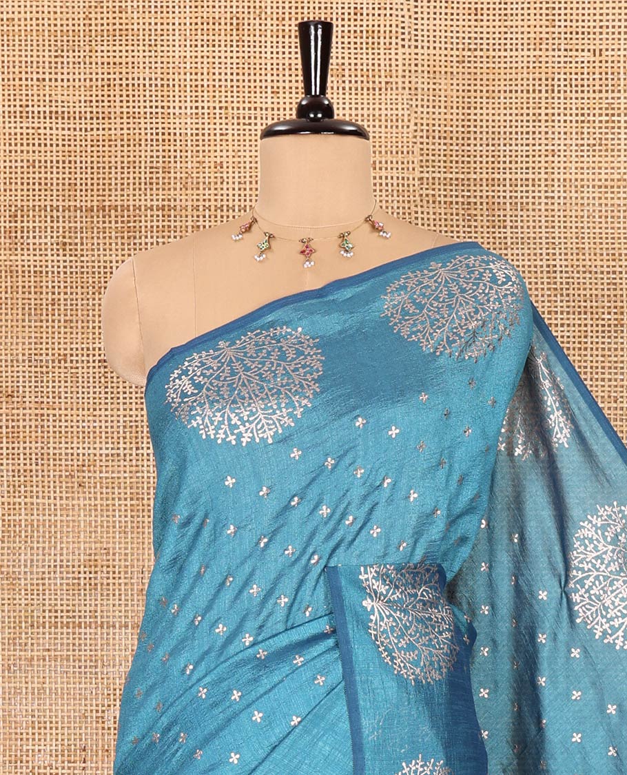 Light blue plus buttas woven Vichitra silk saree, kalpavriksha tree motifs woven on its border, self-pallu, and no blouse