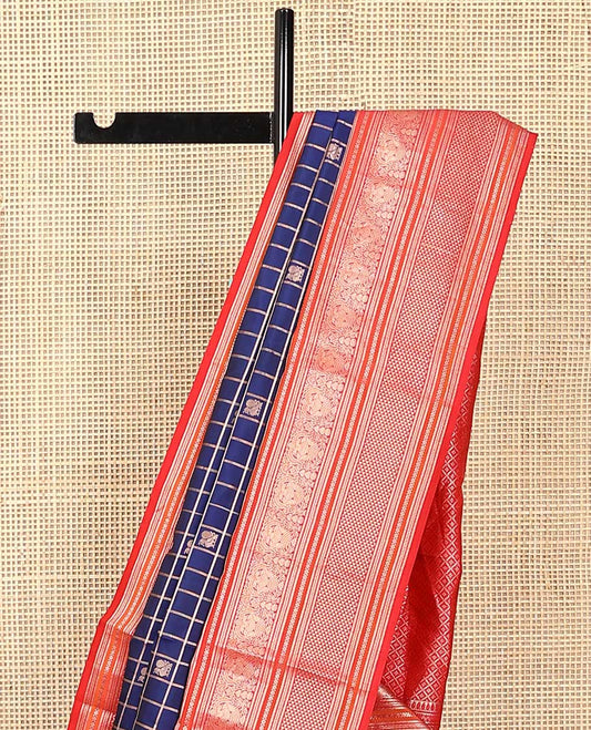 Blue zari checked with annam chakram buttas silk saree, contrast border of thilakam mokku, iruthalai pakshi, and ara maadam designs, and jaal pallu