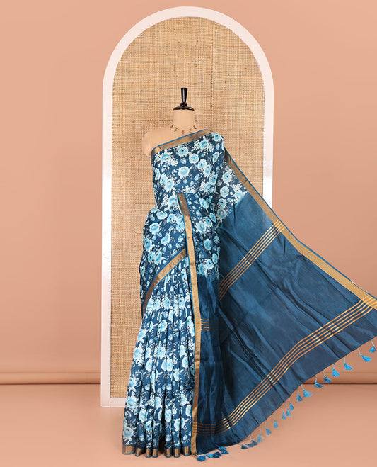 Blue floral motifs digital printed banana pith saree, zari piping border, striped pallu, and a matching floral printed blouse