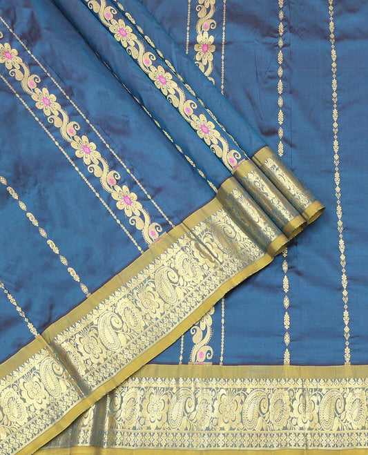 Blue Pure Silk Half-Saree, Adorned with Zari Designs on Its Body, Complemented by a Contrast Floral and Paisley Design Border, Complemented by a Contrast Blouse, and Paired with a Contrast Dhavani of Leaf-Paisley Designs