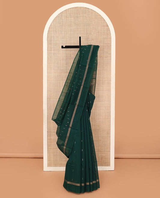 Green zari buttas silk cotton saree, zari striped border, and pallu of zari-rich geometric patterns