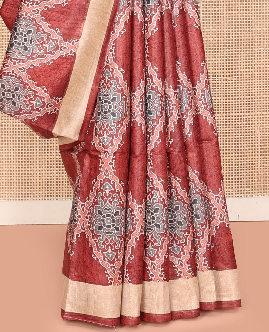 Terracotta Red Tussar Silk Saree, Boldly Accentuated with Ajrakh-Style Jaal Design on Its Body, a Subtle Border, Ombre-Style Striped Pallu, and Paired with a Contrast Blouse