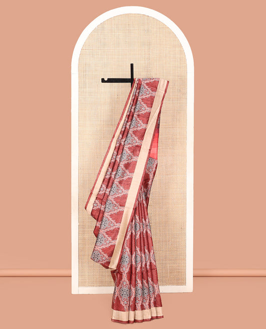 Terracotta Red Tussar Silk Saree, Boldly Accentuated with Ajrakh-Style Jaal Design on Its Body, a Subtle Border, Ombre-Style Striped Pallu, and Paired with a Contrast Blouse