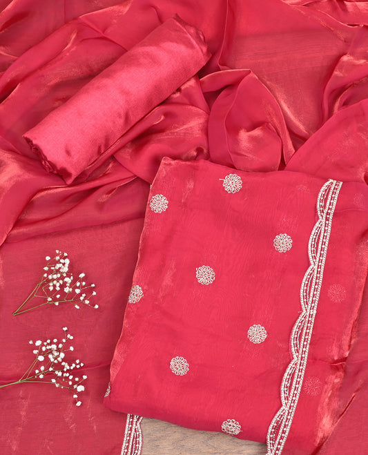 Pink Material Churidar Set, Enriched with Floral Embroidered Motif on Its Top, a Matching Bottom, and Scallop Embroidered Border Dupatta