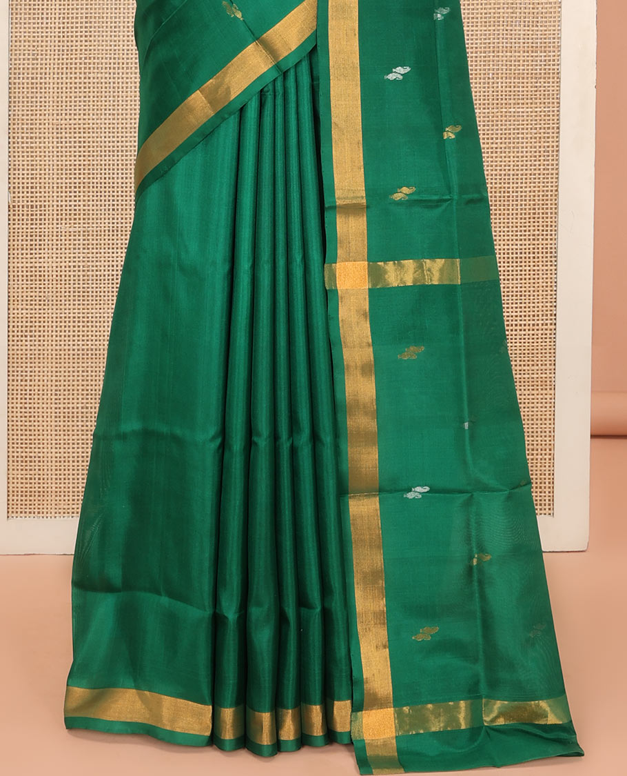 Green Uppada Silk Saree Entralled with Paisley Zari Buttas, Complemented by Bavanji Border, Pallu Depicting Zari Buttas, and Paired with a Matching Blouse