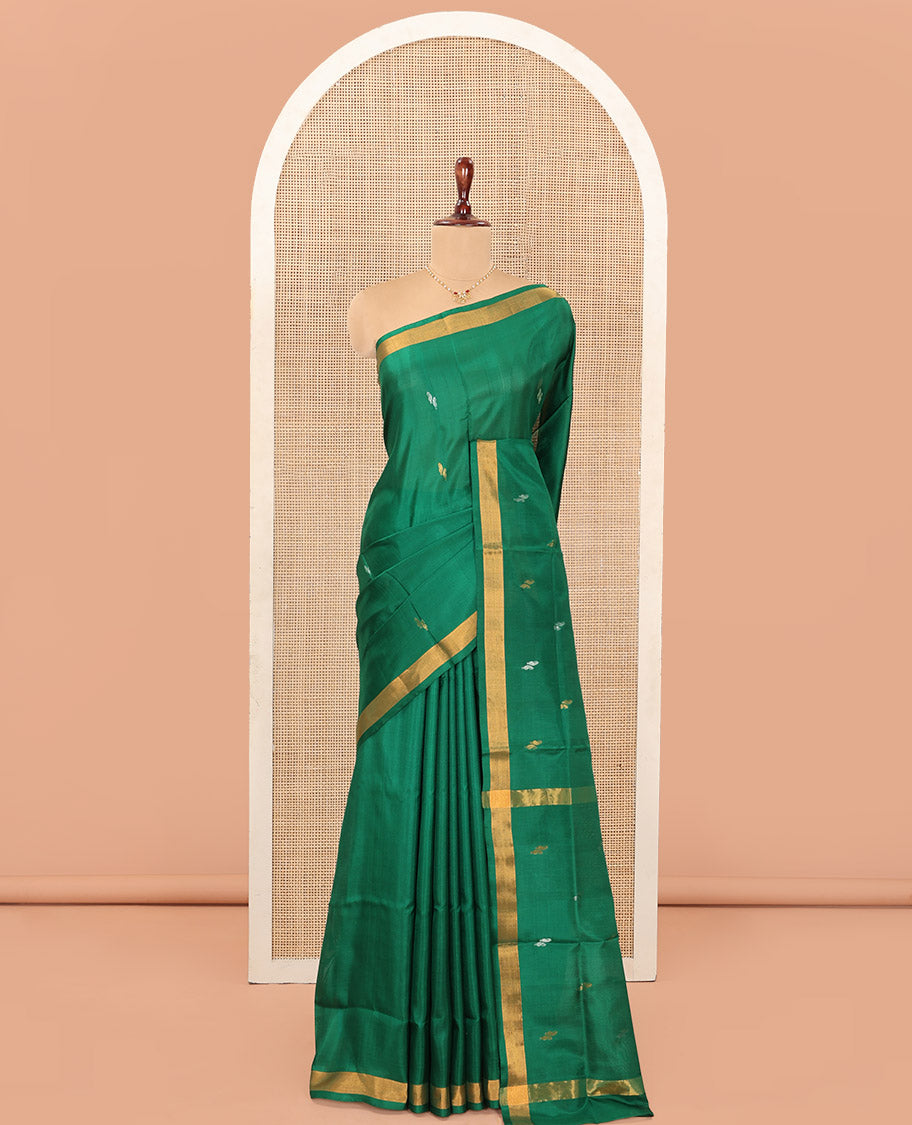 Green Uppada Silk Saree Entralled with Paisley Zari Buttas, Complemented by Bavanji Border, Pallu Depicting Zari Buttas, and Paired with a Matching Blouse