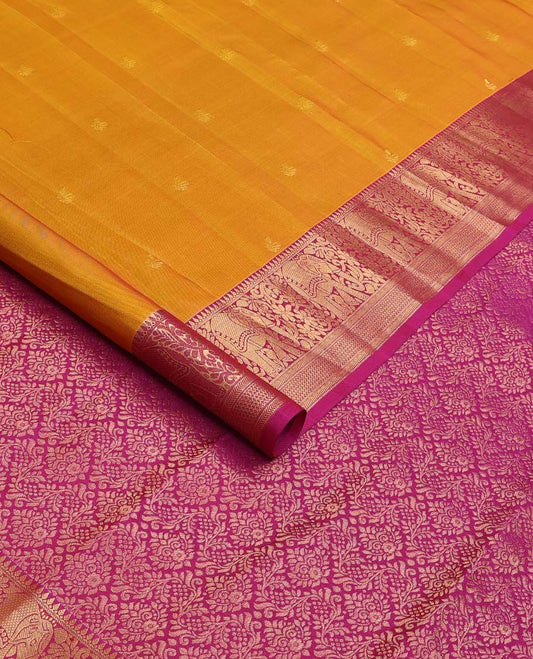 Orange zari buttas Vasundhara silk mix saree, contrast border of thilakam mokku, yaanai, kathir, and zari designs, and intricate pallu