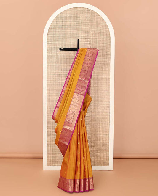 Orange zari buttas Vasundhara silk mix saree, contrast border of thilakam mokku, yaanai, kathir, and zari designs, and intricate pallu