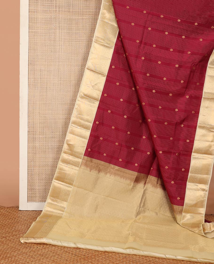 Red stripes, and buttas Vasundhara silk mix saree, contrast border of rekku, muthu, rudraksham, and round mayil designs, and jaal pallu