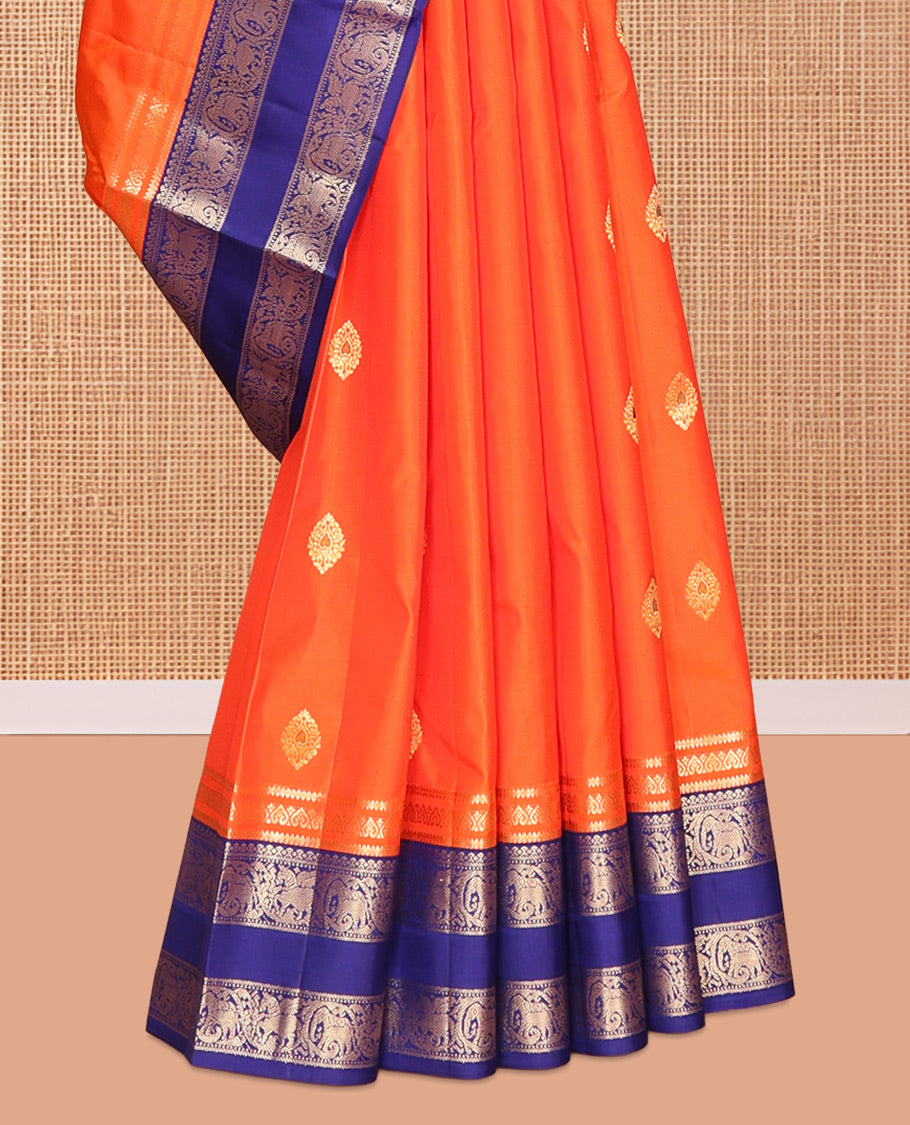 Orange Vasundhara Silk Saree, Adorned with Zari Buttas, Contrast Rettai Pettu Border of Yaanai, and Kuthirai Designs, Grand Pallu, and a Contrast Blouse