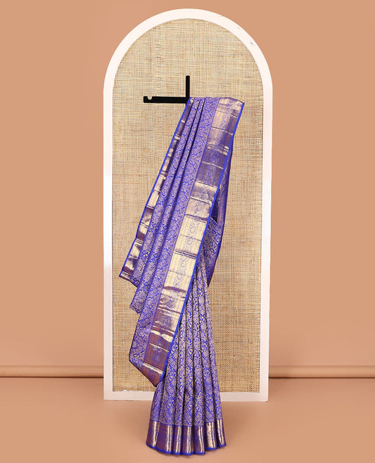 Royal blue jacquard kanchipuram silk saree, zari border of thazampoo rekku, muthu, kathir, kuyil kann, and dhavana kodi designs, and intricate pallu