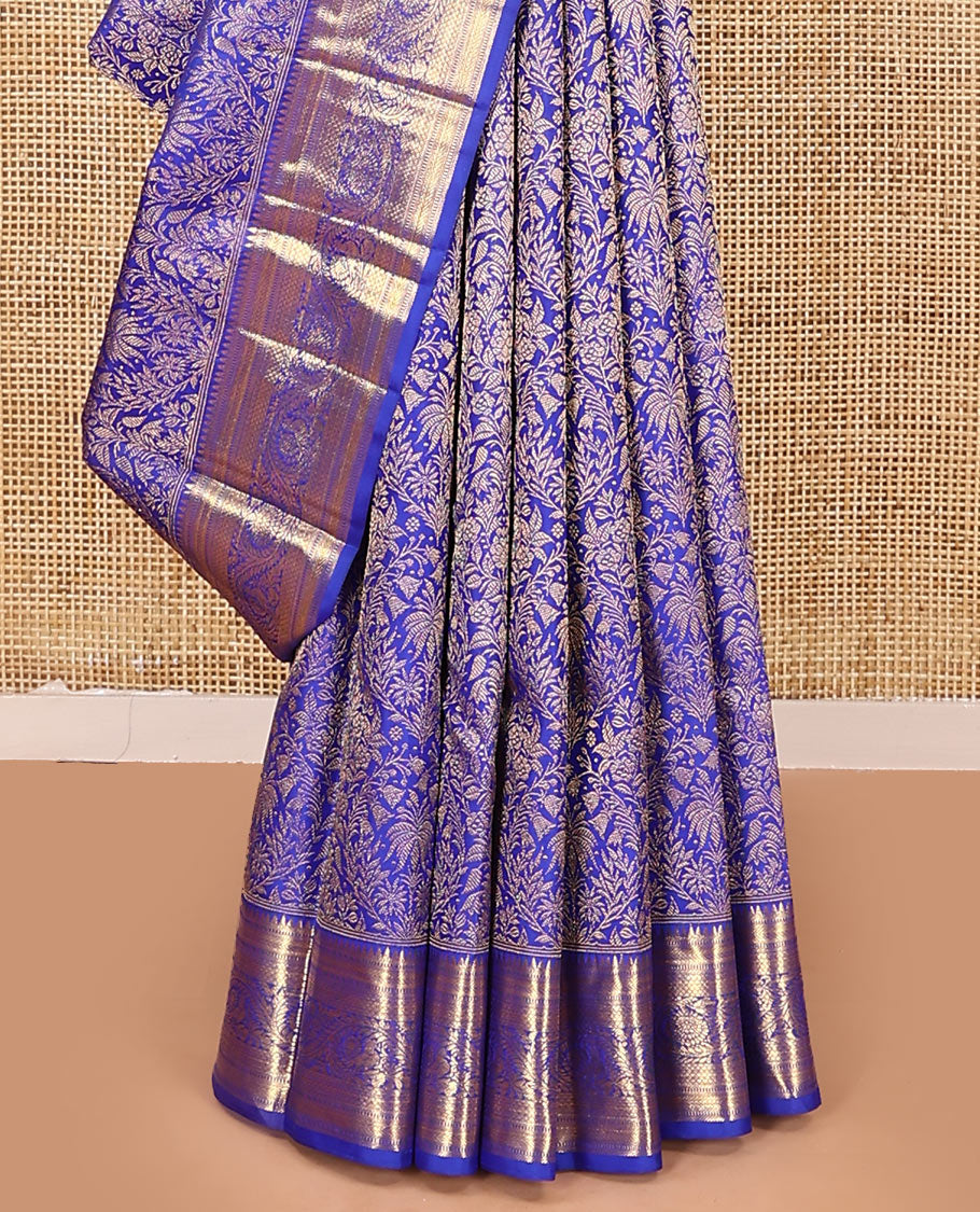 Royal blue jacquard kanchipuram silk saree, zari border of thazampoo rekku, muthu, kathir, kuyil kann, and dhavana kodi designs, and intricate pallu