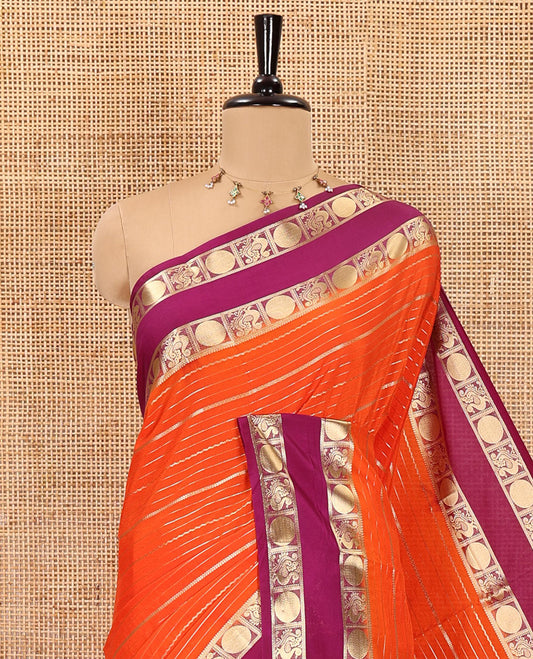 Orange gold zari design art crepe saree, contrast rettai pettu, peacock chakram zari border, zari-rich pallu, and a contrast zari design blouse