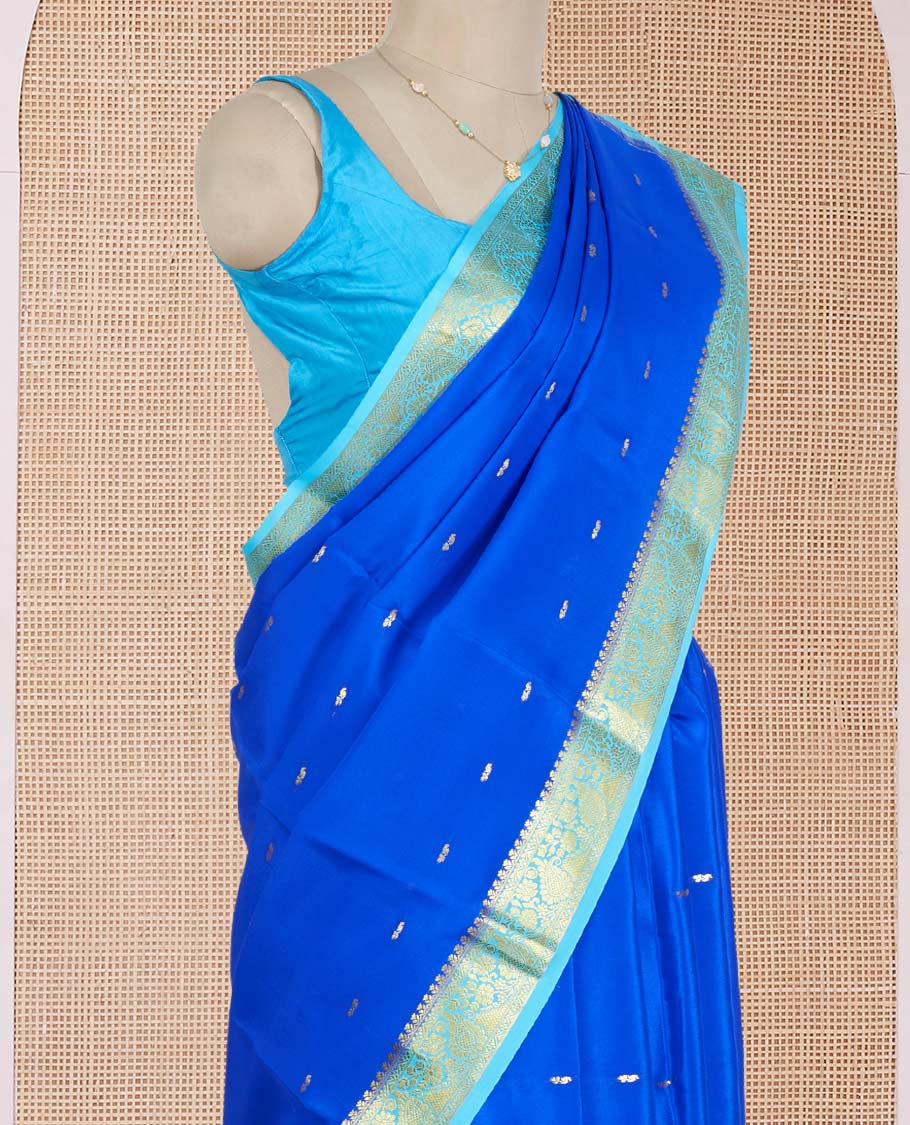 Royal Blue Mysore Silk Saree Adorned with Golden Zari Buttas, Featuring a Contrast Floral-Paisley Design Border, a Pallu Prettified with Zari Designs, and Paired with a Contrast Blouse
