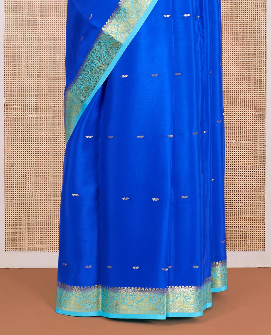 Royal Blue Mysore Silk Saree Adorned with Golden Zari Buttas, Featuring a Contrast Floral-Paisley Design Border, a Pallu Prettified with Zari Designs, and Paired with a Contrast Blouse