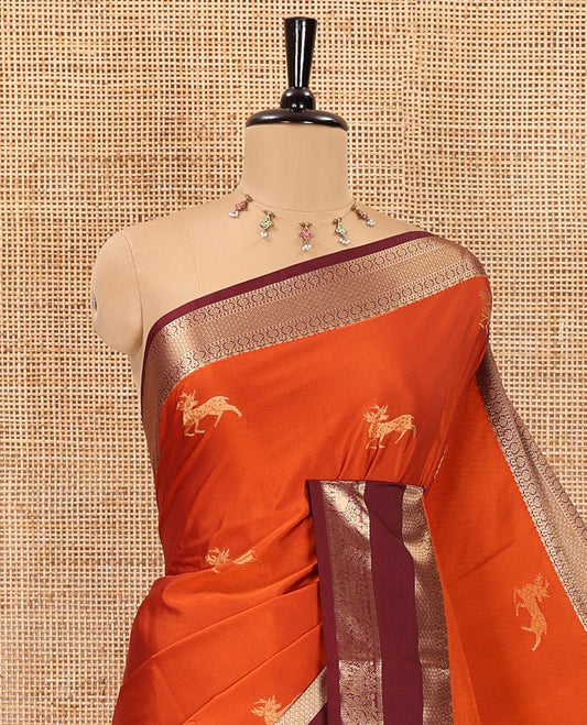 Orange deer motifs zari woven kanchi soft silk saree, contrast traditional zari design rettai pettu border, pallu of Mughal-style floral designs, and contrast plain blouse