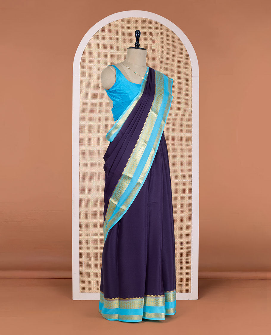 Navy Blue Plain Mysore Silk Saree, Delicately Woven by a Contrast Rettai Pettu Border of Traditional Zari Designs, a Subtly Sparkled Pallu of Zari Stripes, and a Contrast Blouse