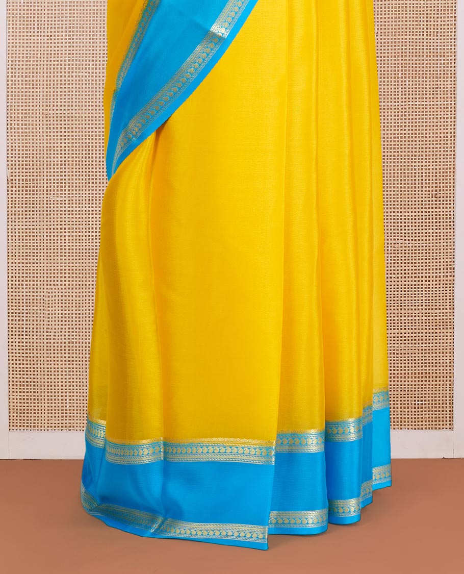 Yellow Plain Mysore Silk Saree, Complemented by a Contrast Rettai Pettu Border of Traditional Zari Designs, a Subtly Sparkled Pallu of Zari Stripes, and a Contrast Blouse