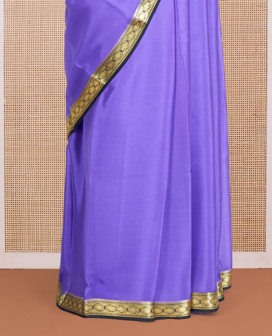 Lavender Plain Mysore Silk Saree, Complemented by a Contrast Zari Border of Traditional Designs, a Pallu Gleamed Up with Zari Stripes, and a Contrast Blouse