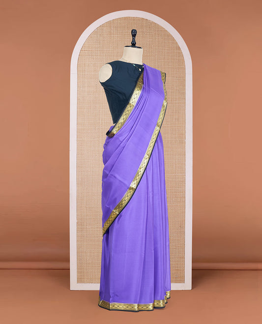 Lavender Plain Mysore Silk Saree, Complemented by a Contrast Zari Border of Traditional Designs, a Pallu Gleamed Up with Zari Stripes, and a Contrast Blouse