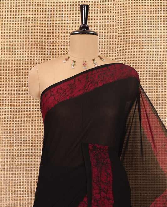 Black and purple plain georgette saree, batik printed border, batik printed checked pallu, and a matching blouse